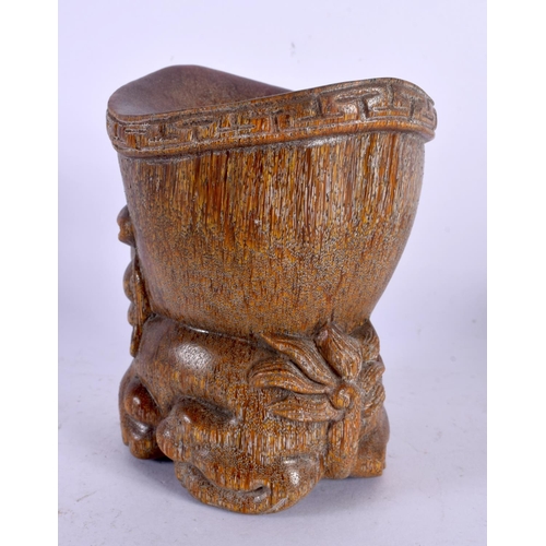 1637 - A CHINESE CARVED BUFFALO HORN TYPE LIBATION CUP 20th Century. 11 cm x 9 cm.