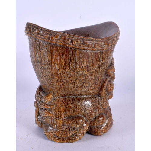 1637 - A CHINESE CARVED BUFFALO HORN TYPE LIBATION CUP 20th Century. 11 cm x 9 cm.