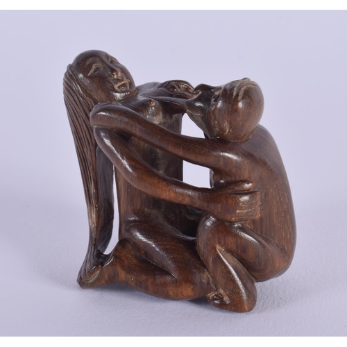 1649 - A JAPANESE CARVED BOXWOOD EROTIC NETSUKE. 5 cm x 5.5 cm.