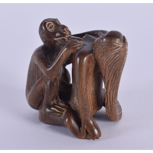 1649 - A JAPANESE CARVED BOXWOOD EROTIC NETSUKE. 5 cm x 5.5 cm.