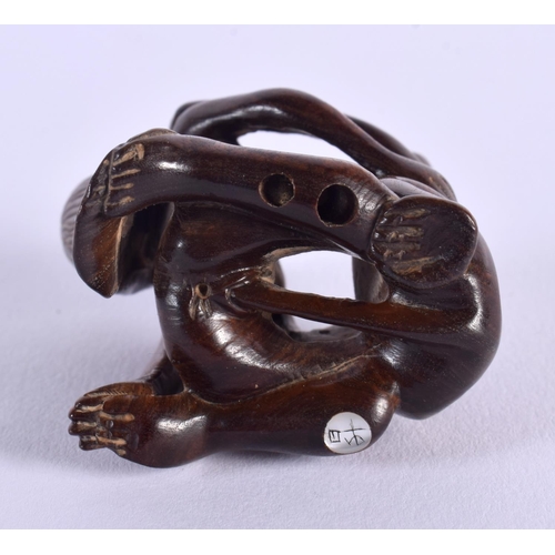 1649 - A JAPANESE CARVED BOXWOOD EROTIC NETSUKE. 5 cm x 5.5 cm.