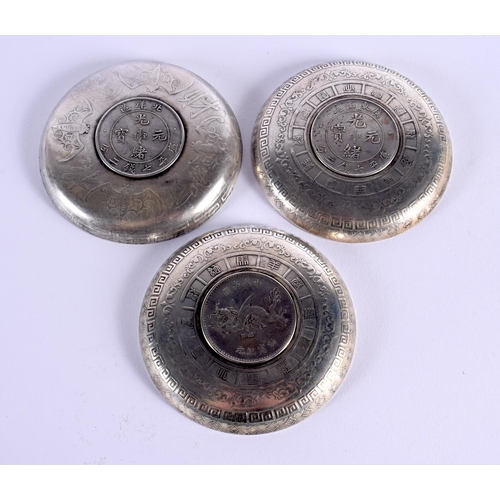 1654 - THREE CHINESE WHITE METAL COIN DISHES 20th Century. 330 grams. 9.25 cm diameter. (3)