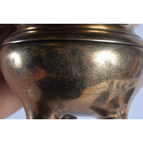 1682 - A 19TH CENTURY CHINESE TWIN HANDLED BRONZE CENSER Qing, engraved with motifs and vines. 681 grams. 1... 