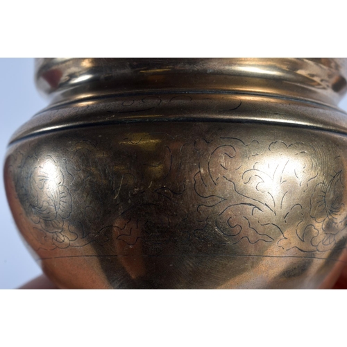 1682 - A 19TH CENTURY CHINESE TWIN HANDLED BRONZE CENSER Qing, engraved with motifs and vines. 681 grams. 1... 