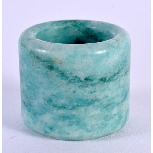 1693 - A CHINESE CARVED JADE ARCHERS RING 20th Century. 2.25 cm wide.