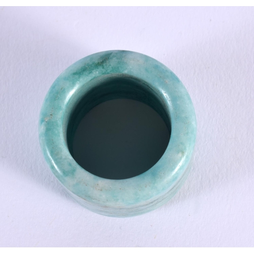 1693 - A CHINESE CARVED JADE ARCHERS RING 20th Century. 2.25 cm wide.