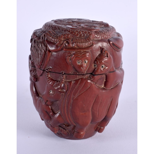 1697 - A JAPANESE CARVED WOOD BOX AND COVER. 8 cm x 6 cm.