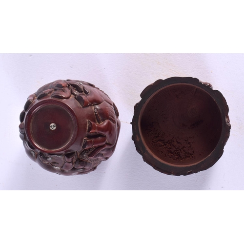 1697 - A JAPANESE CARVED WOOD BOX AND COVER. 8 cm x 6 cm.