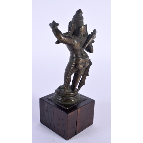 1699 - A 19TH CENTURY MIDDLE EASTERN INDIAN BRONZE DEITY upon a wooden plinth. 14 cm high.