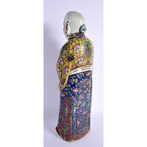 1740 - A LARGE CHINESE REPUBLICAN PERIOD FAMILLE ROSE FIGURE embellished in floral robes. 45 cm high.