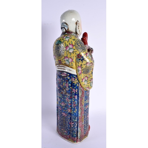 1740 - A LARGE CHINESE REPUBLICAN PERIOD FAMILLE ROSE FIGURE embellished in floral robes. 45 cm high.