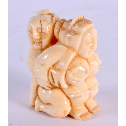 1745 - A JAPANESE CARVED BONE EROTIC NETSUKE. 4.5 cm x 3.5 cm.