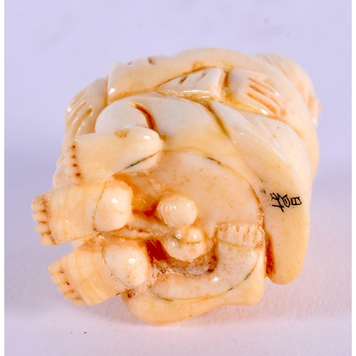 1745 - A JAPANESE CARVED BONE EROTIC NETSUKE. 4.5 cm x 3.5 cm.