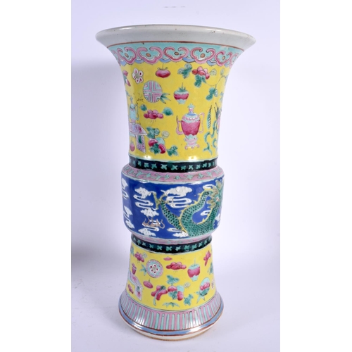 1815 - A 19TH CENTURY CHINESE FAMILLE JAUNE PORCELAIN GU FORM BEAKER VASE Qing. 36 cm x 15 cm.