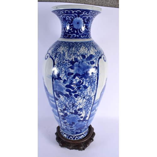 1817 - A LARGE 19TH CENTURY JAPANESE MEIJI PERIOD BLUE AND WHITE VASE upon an antique Chinese stand. 65 cm ... 