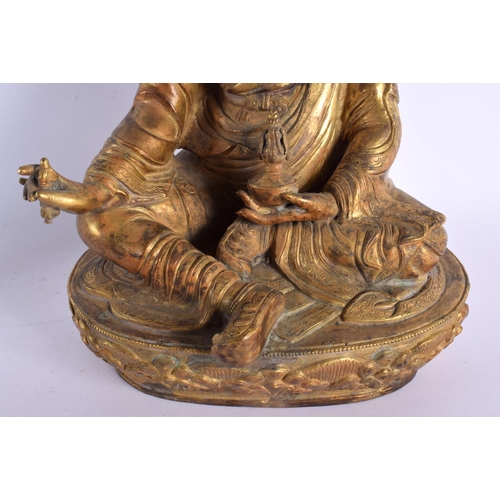 1830 - A LARGE 19TH CENTURY CHINESE TIBETAN BRONZE FIGURE OF A BUDDHA modelled holding a stupa. 38 cm x 15 ... 