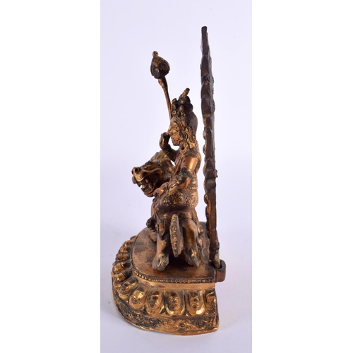 1831 - A 19TH CENTURY CHINESE TIBETAN GILT BRONZE FIGURE OF A BUDDHA modelled riding upon a beast. 19 cm x ... 