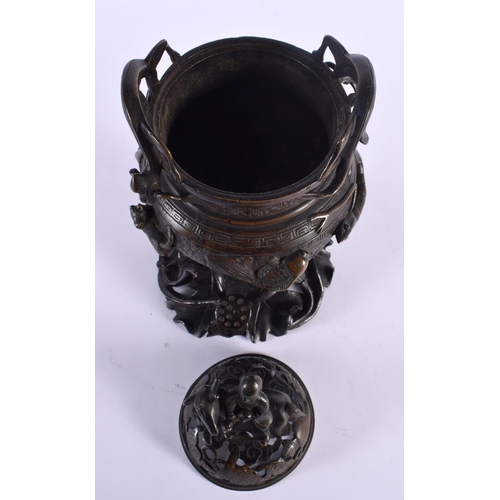 1922 - A LARGE 18TH/19TH CENTURY CHINESE TWIN HANDLED BRONZE CENSER AND COVER Ming style, overlaid with shr... 