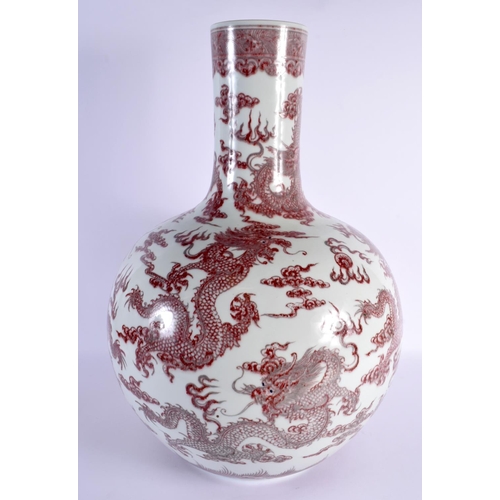 1929 - A LARGE CHINESE IRON RED GLAZED PORCELAIN BULBOUS VASE probably 19th century, bearing Qianlong marks... 