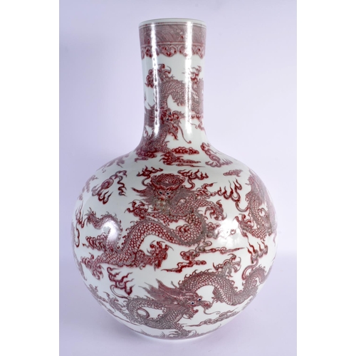 1929 - A LARGE CHINESE IRON RED GLAZED PORCELAIN BULBOUS VASE probably 19th century, bearing Qianlong marks... 