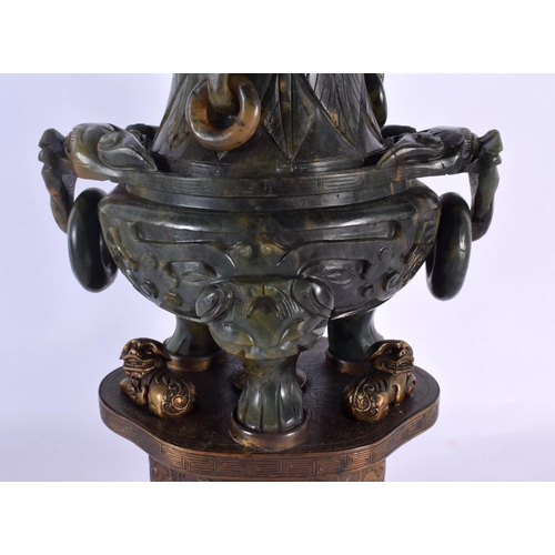 1946 - A LARGE 19TH CENTURY CHINESE TWIN HANDLED JADE CENSER AND COVER LAMP upon a repousse gilt metal base... 