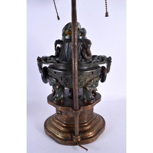 1946 - A LARGE 19TH CENTURY CHINESE TWIN HANDLED JADE CENSER AND COVER LAMP upon a repousse gilt metal base... 