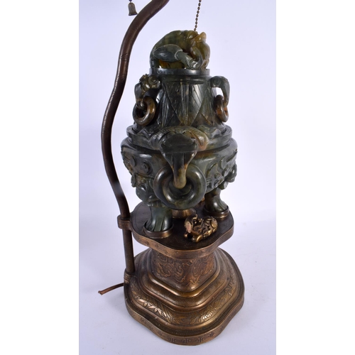 1946 - A LARGE 19TH CENTURY CHINESE TWIN HANDLED JADE CENSER AND COVER LAMP upon a repousse gilt metal base... 