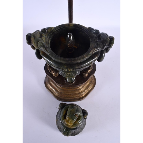 1946 - A LARGE 19TH CENTURY CHINESE TWIN HANDLED JADE CENSER AND COVER LAMP upon a repousse gilt metal base... 