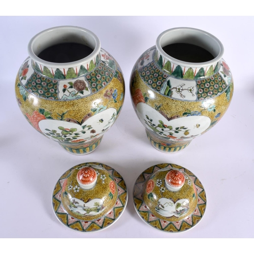 1949 - A LARGE PAIR OF CHINESE FAMILLE JAUNE VERTE PORCELAIN VASES AND COVERS 20th Century. 44 cm x 16 cm.