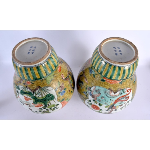 1949 - A LARGE PAIR OF CHINESE FAMILLE JAUNE VERTE PORCELAIN VASES AND COVERS 20th Century. 44 cm x 16 cm.