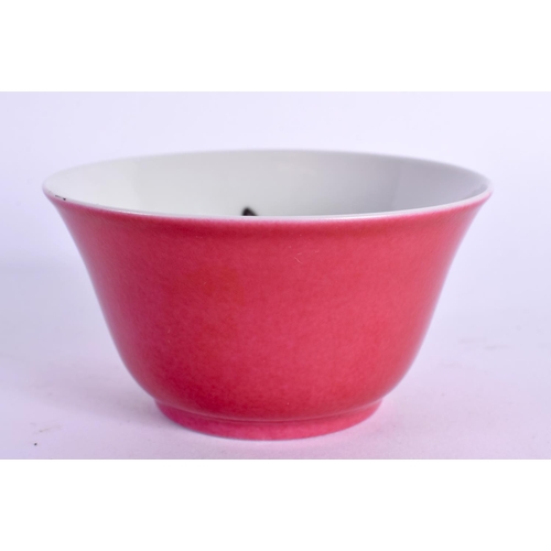 1967 - AN EARLY 20TH CENTURY CHINESE RUBY GROUND PORCELAIN TEABOWL Late Qing/Republican. 7 cm diameter.