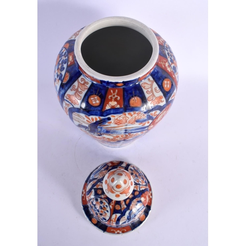 1976 - A LARGE 19TH CENTURY JAPANESE MEIJI PERIOD IMARI VASE AND COVER together with a pair of similar plat... 