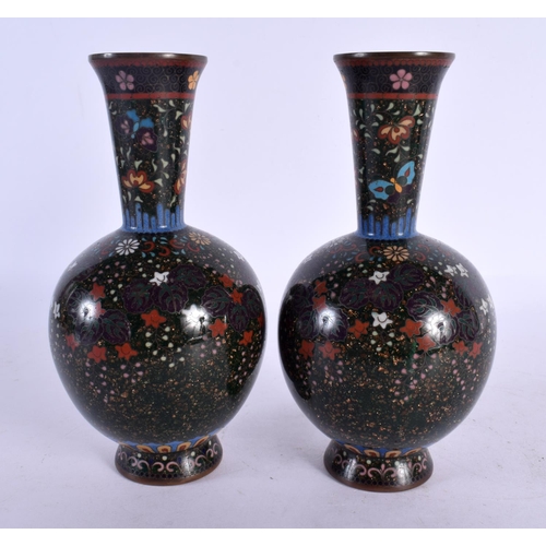 1981 - A FINE PAIR OF 19TH CENTURY JAPANESE MEIJI PERIOD CLOISONNE ENAMEL VASES decorated with foliage on a... 