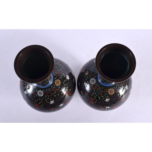 1981 - A FINE PAIR OF 19TH CENTURY JAPANESE MEIJI PERIOD CLOISONNE ENAMEL VASES decorated with foliage on a... 