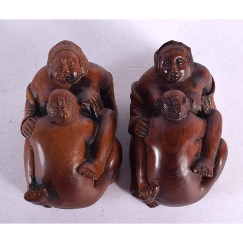 1997 - A CHARMING PAIR OF JAPANESE CARVED BOXWOOD EROTIC NETSUKES modelled with figures romping. 7 cm x 3 c... 