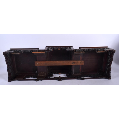 2006 - A LARGE 19TH CENTURY CHINESE CARVED HARDWOOD THREE STEPPED STAND Qing. 54 cm x 18 cm x 16 cm.