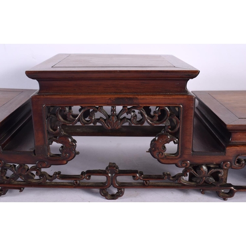 2006 - A LARGE 19TH CENTURY CHINESE CARVED HARDWOOD THREE STEPPED STAND Qing. 54 cm x 18 cm x 16 cm.