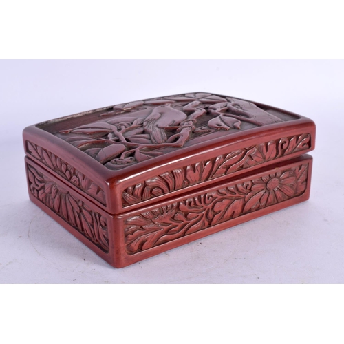 2015 - A 19TH CENTURY JAPANESE MEIJI PERIOD RED LACQUER BOX AND COVER decorated with birds amongst foliage.... 