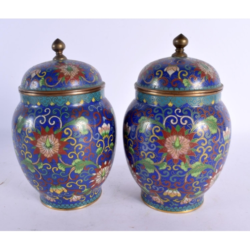 2023 - A PAIR OF 19TH CENTURY CHINESE CLOISONNE ENAMEL VASES AND COVER decorated with foliage. 18 cm x 8 cm... 