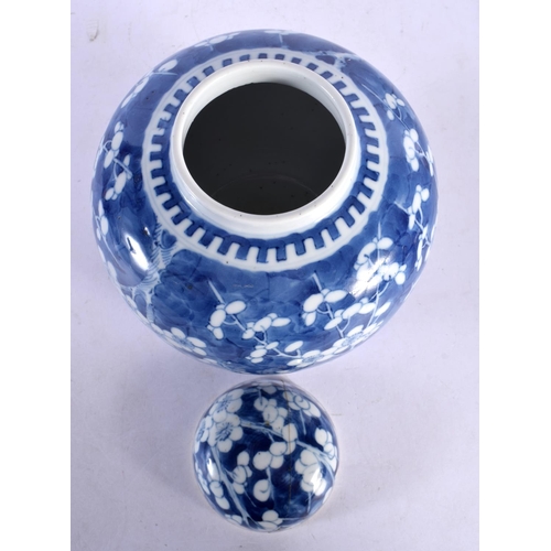 2031 - A LARGE 19TH CENTURY CHINESE BLUE AND WHITE PORCELAIN GINGER JAR AND COVER bearing Kangxi marks to b... 