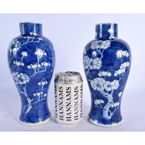 2032 - A PAIR OF 19TH CENTURY CHINESE BLUE AND WHITE VASES bearing Kangxi marks to base. 24 cm high.