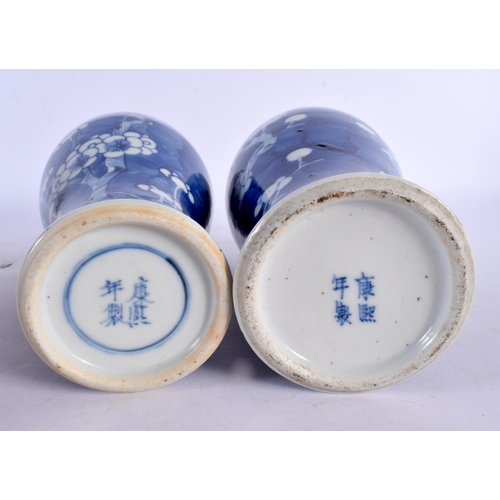 2032 - A PAIR OF 19TH CENTURY CHINESE BLUE AND WHITE VASES bearing Kangxi marks to base. 24 cm high.