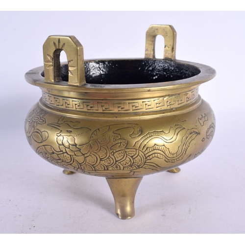 2048 - A LATE 19TH CENTURY CHINESE TWIN HANDLED BRONZE CENSER bearing Xuande marks to base. 12 cm wide.