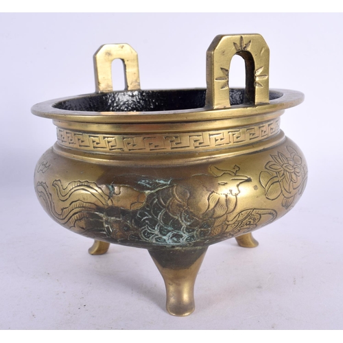 2048 - A LATE 19TH CENTURY CHINESE TWIN HANDLED BRONZE CENSER bearing Xuande marks to base. 12 cm wide.