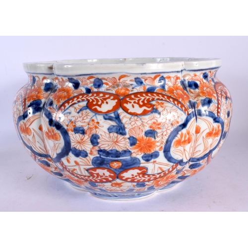 2056 - A LARGE 19TH CENTURY JAPANESE MEIJI PERIOD LOBED IMARI PLANTER painted with foliage. 25 cm x 18 cm.