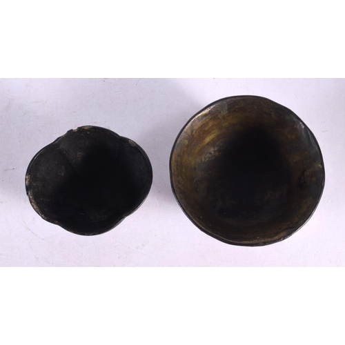 2064 - TWO 17TH/18TH CENTURY CHINESE BLACK LACQUER TEABOWLS Kangxi/Yongzheng. Largest 7.5 cm wide. (2)