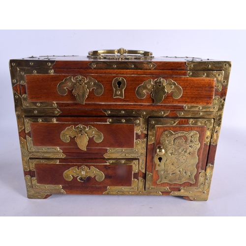 2068 - AN EARLY 20TH CENTURY CHINESE CARVED HARDWOOD BRASS BOUND CASKET overlaid with figures and bats. 30 ... 