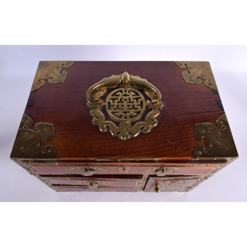 2068 - AN EARLY 20TH CENTURY CHINESE CARVED HARDWOOD BRASS BOUND CASKET overlaid with figures and bats. 30 ... 