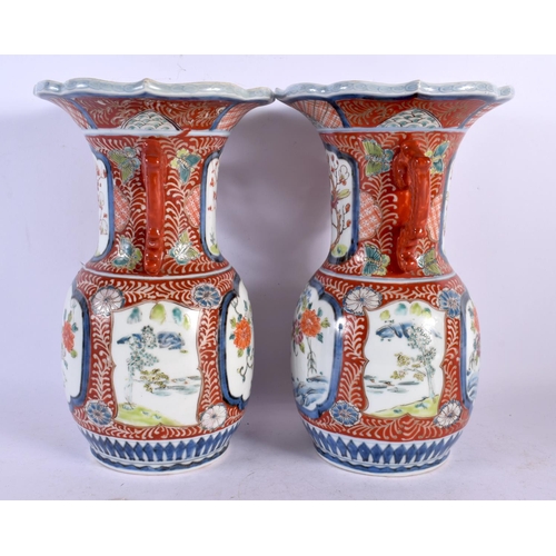 2089 - A PAIR OF 19TH CENTURY JAPANESE MEIJI PERIOD TWIN HANDLED IMARI VASE painted with foliage. 26 cm x 1... 