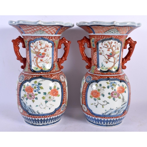 2089 - A PAIR OF 19TH CENTURY JAPANESE MEIJI PERIOD TWIN HANDLED IMARI VASE painted with foliage. 26 cm x 1... 